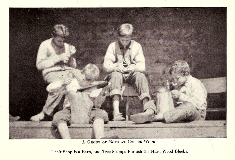 Chapter VIII., ch.8, Plate - A group of Boys at Copper Work, Their shop is a barn and Tree Stumps Furnish the Hard Wood Blocks.